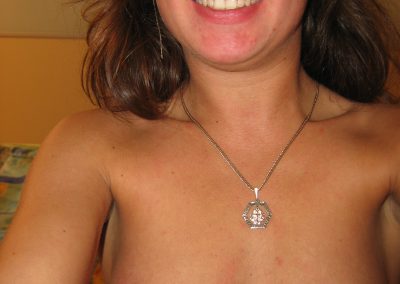 Selfie of smiling topless girl