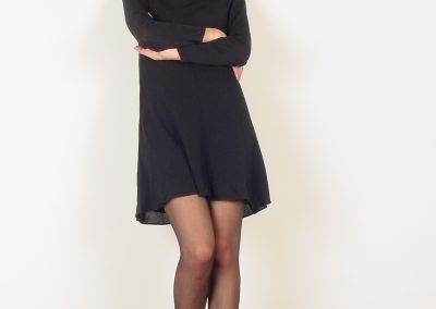 Blonde posing in dress and black pantyhose