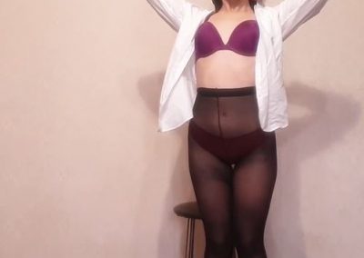 Girl Putting Shirt On With Black Pantyhose