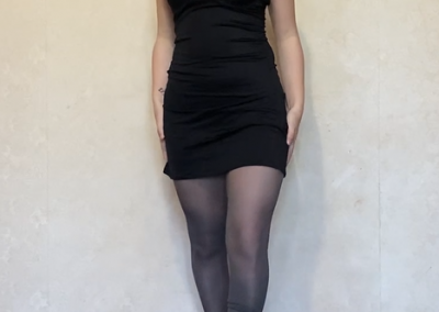 Brunette Black Mini Dress and Grey Pantyhose and Heels