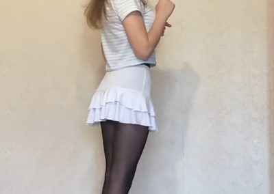 Side view of Stacy in Black Pantyhose and Flirty White Dress