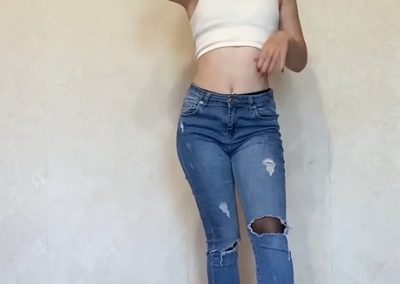 Petite babe in belly shirt, jeans and pantyhose
