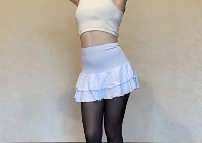 Pulling Hair Up In White Skirt and Pantyhose