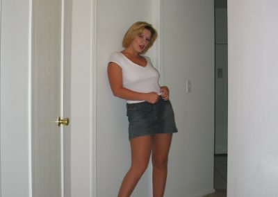 Thick Blonde Woman In Mini Skirt and Tan Pantyhose