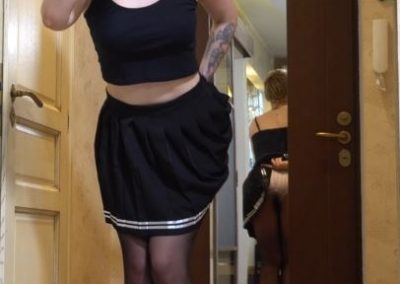 Girl Lifting her skirt to show panties and pantyhose ass