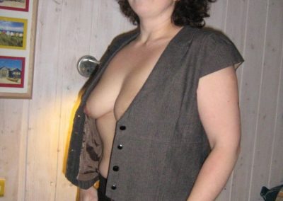 Sexy Older lady unbuttoning shirt