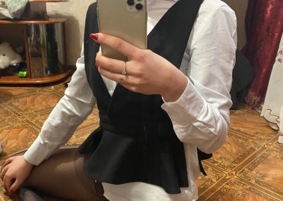 Girl sending sexy selfie in dress shirt and black pantyhose