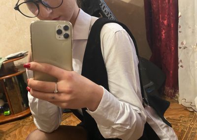 Girl Wearing Glasses and Pantyhose In Selfie