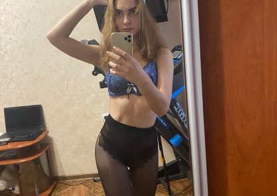 Amateur girl taking selfie in sexy pantyhose