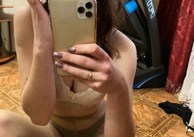 pretty girl in hat sending pantyhose selfie