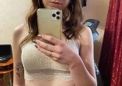 Amateur woman in sports bra and pantyhose selfie