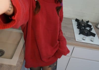 Asian hottie in pantyhose and red sweater selfie