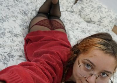 Asian girl in red sweater and pantyhose selfie
