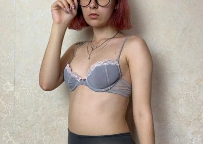 Sexy Librarian with pink hair in her bra, panties and pantyhose