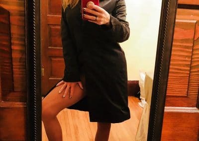 Sexy Woman In Coat and Tan Pantyhose Taking Selfie